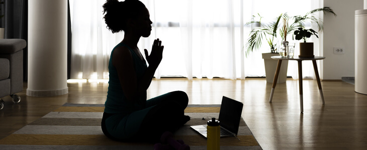 A young woman practicing yoga