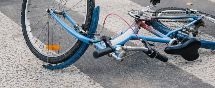 overturned bicycle lying on a crosswalk